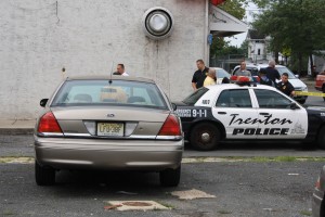 Police investigate the scene of Rasheen Jones' shooting death. (Photo By Ana Ceballos)