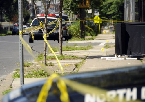 File photo - Evidence markers litter a crime scene.