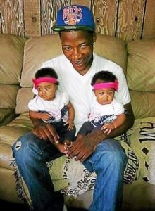 Contributed Photo Nyquan Owens poses with his two cousins earlier this year. Owens was murdered over the weekend.