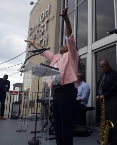 Minister Denise Scott leads a prayer outside the Shiloh Baptist Church in Trenton on the National Day of Prayer Thursday May 1, 2014. (Trentonian photo/Jakcie Schear)