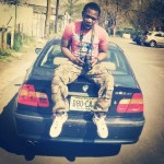 Ira Charles sitting on his BMW