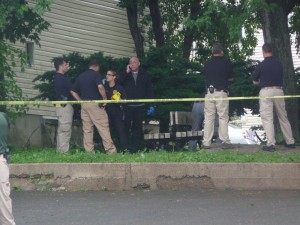 Police investigate murder outside of Candlelight Lounge, June 9, 2014.