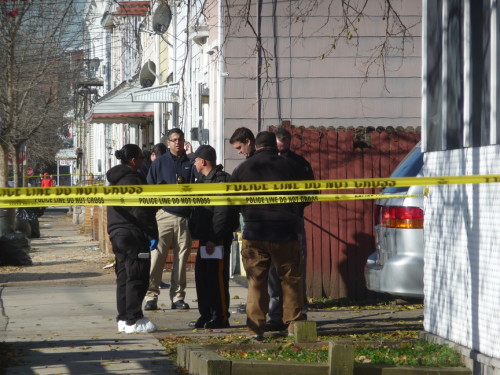 Police investigate a murder on Division Street. November 24, 2015 (Penny Ray - Trentonian)