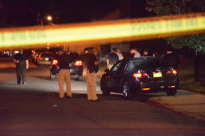 Police investigate a murder in the 100 block of Miller Street. (Penny Ray - Trentonian) 